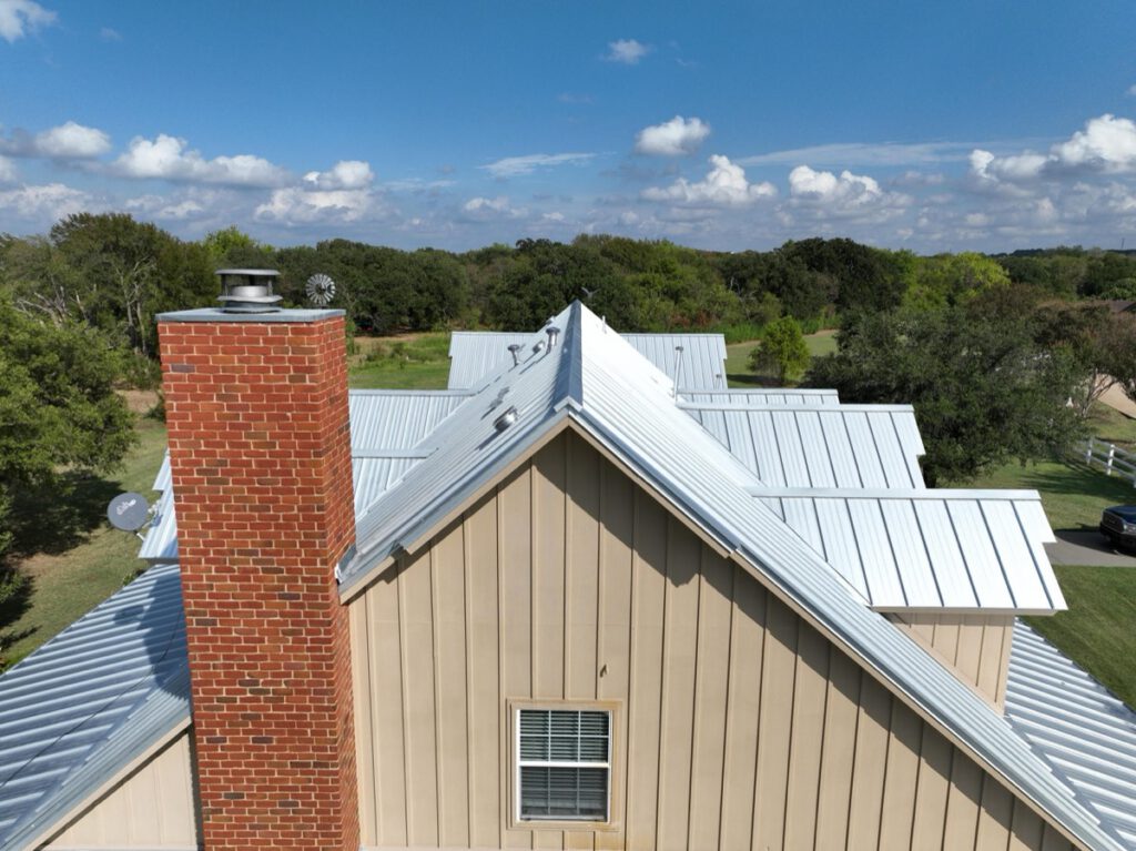 Standing seam metal roofing panels installed on a Texas home