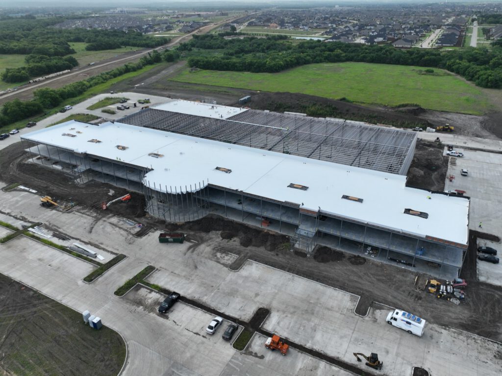 Aerial commercial TPO roofing installation, Texas